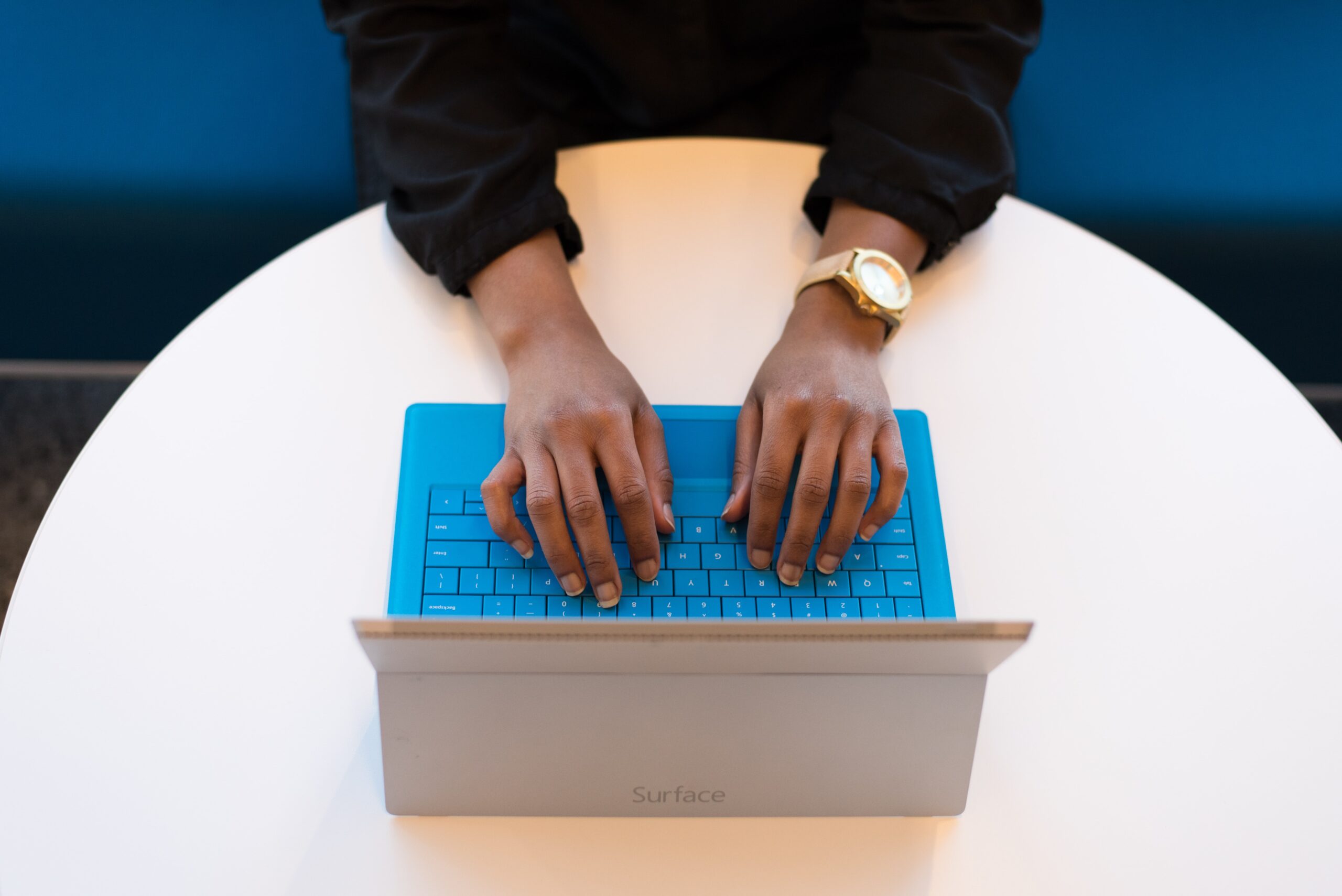 Person typing on keyboard